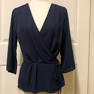 Plunge neck self tie peplum top